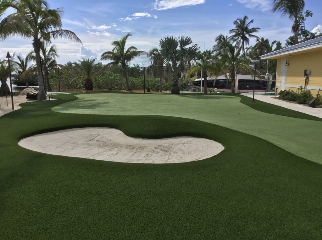 Bunker and putting green at outdoor backyard FL Keys golfing project