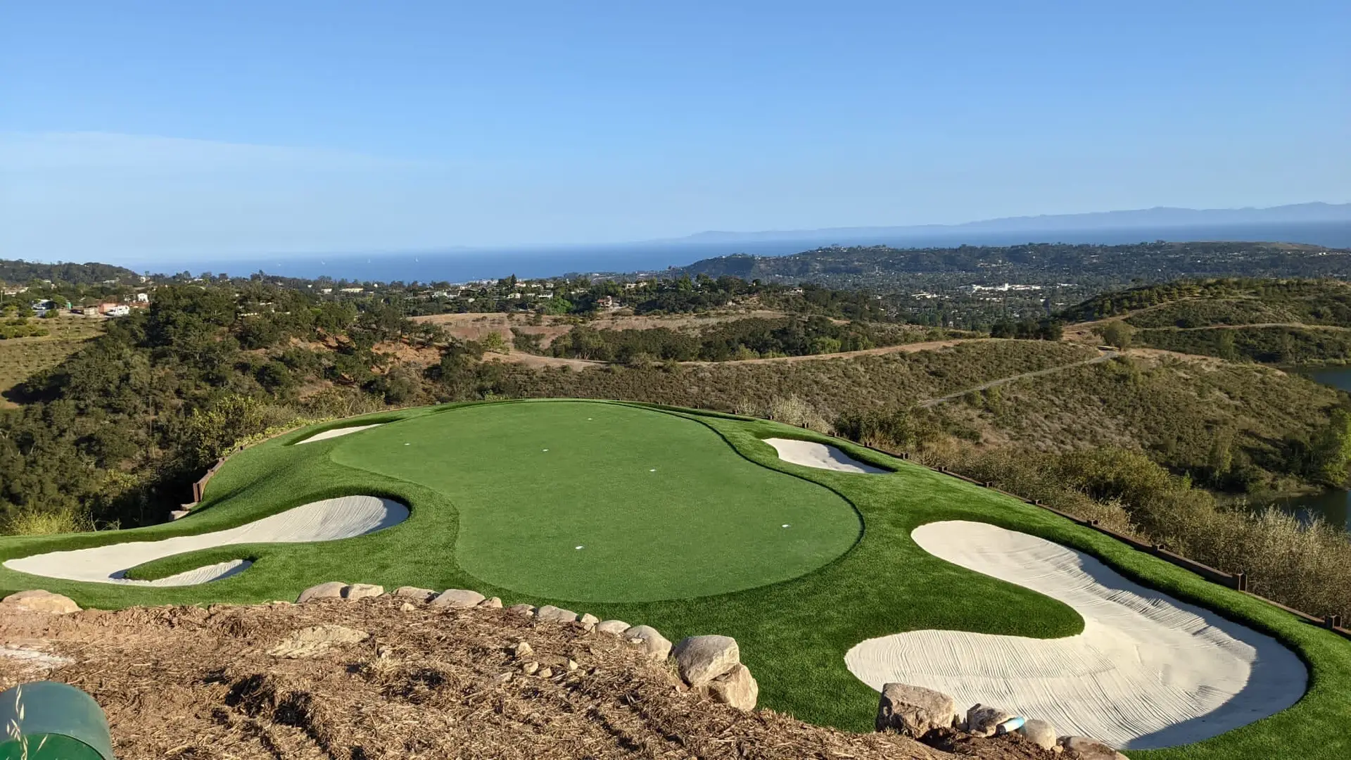 custom putting green on private estate with view