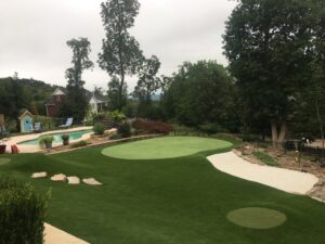 backyard artificial grass landscaping with putting green