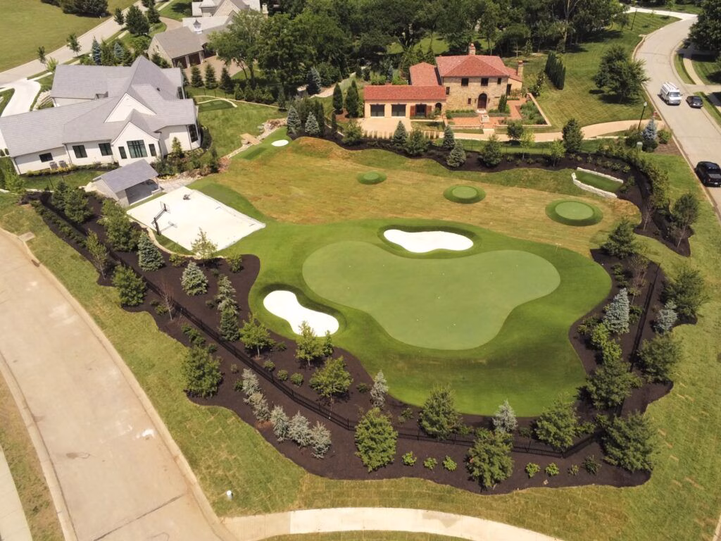 Aerial photo of a backyard putting green with multizone practice area
